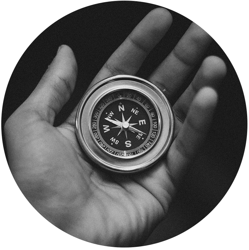 hand holding compass